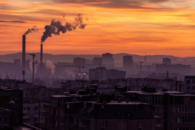 Polluting factories, representing the environmental cost of AI.