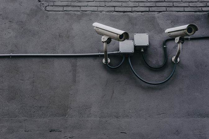 Security cameras watching over a public space.
